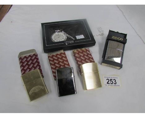 A pocket watch and 4 cigarette lighters
