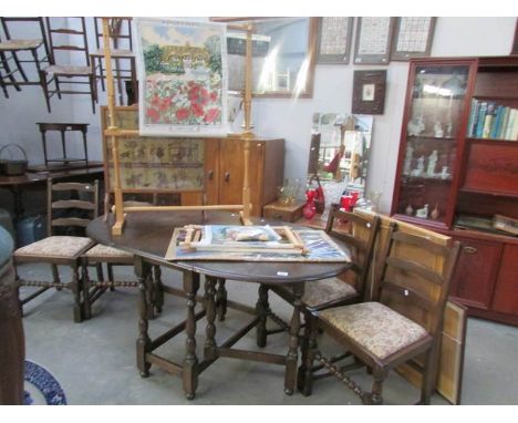 An oak gate leg table and 4 ladderback chairs