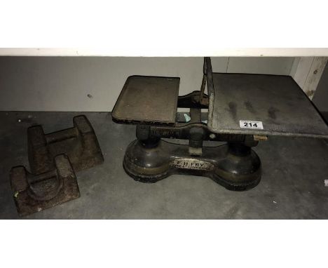 A set of cast iron scales & 2 large weights