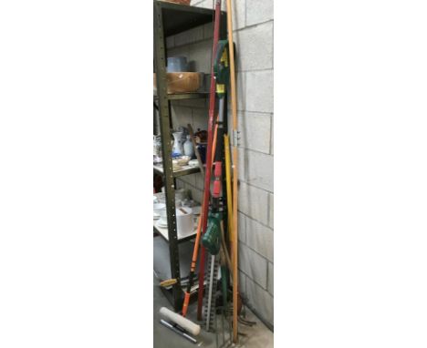 A Qualcast long handled strimmer and other tools