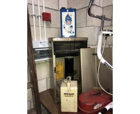 An old paraffin stove and vintage paraffin cans, Blue Esso etc