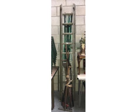 A wooden ladder, tools etc