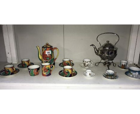 A coffee set featuring abstract pattern including 4 cups/saucers, coffee pot, milk & sugar & other tea/saucer sets & silver p