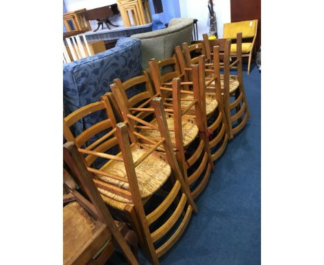 A set of eight ladder back chairs