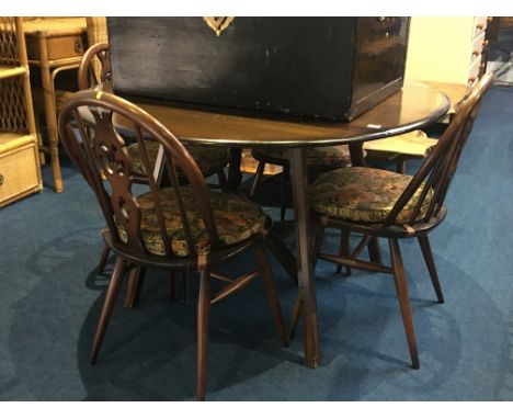 Ercol drop leaf dining table and four wheel back chairs