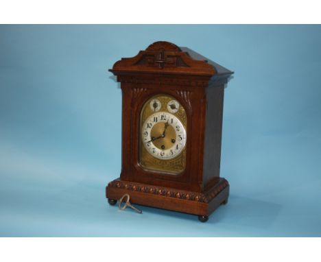 Oak bracket clock with strike action, eight day movement