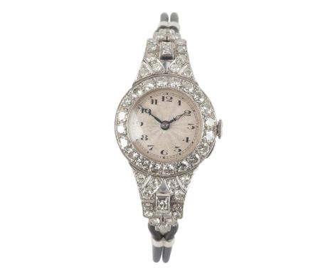 AN ART DECO DIAMOND AND WHITE METAL COCKTAIL WATCHwith manual wind movement, the cream dial with black Arabic numerals and da
