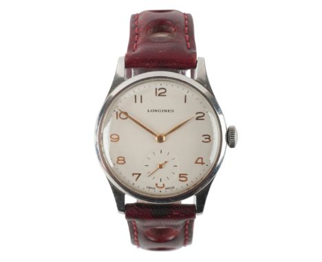 LONGINES: A STAINLESS STEEL WRISTWATCHwith manual wind movement, the white dial with gold Arabic numerals and hands, subsidia