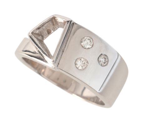 A DIAMOND DRESS RINGin 18ct white gold, in a contemporary buckle design, set with three round brilliant cut diamonds, held in