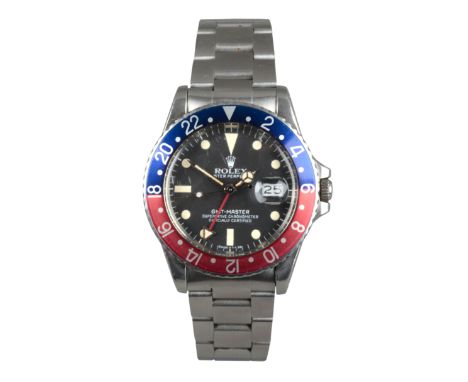 ROLEX GMT MASTER OYSTER PERPETUAL: A STAINLESS STEEL BRACELET WATCHwith automatic movement, the black dial with date aperture