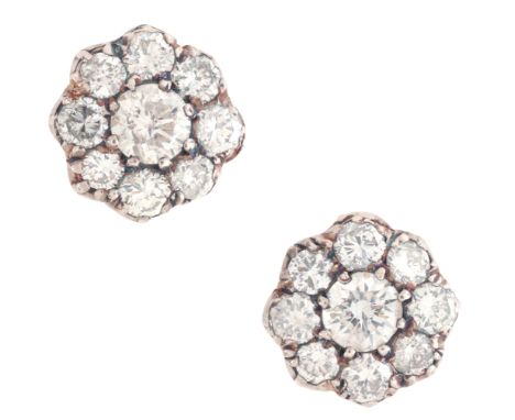A PAIR OF DIAMOND CLUSTER STUD EARRINGSin 18ct gold and silver, each set with a cluster of round brilliant cut diamonds, secu