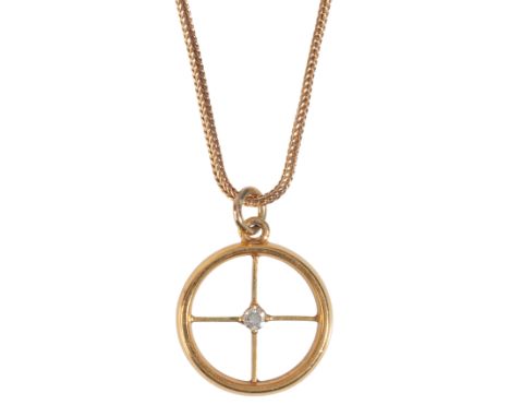 A DIAMOND PENDANT NECKLACEcomprising a 22ct gold wedding band, retro-set with a round brilliant cut diamond of c.0.10 carats 
