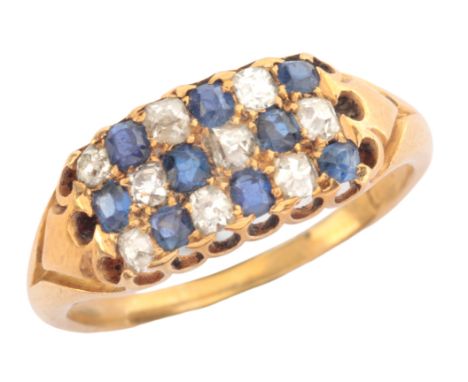 A SAPPHIRE AND DIAMOND CHEQUER BOARD RINGin 18ct gold, pavé-set with cushion cut sapphires and old cut diamonds to stylised s