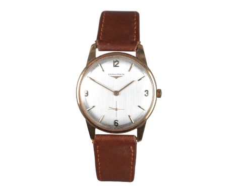 LONGINES: A 9CT GOLD WRISTWATCHwith manual wind movement, the silver dial with gold hands, gold Arabic and baton numerals, wi
