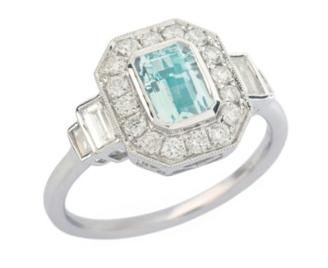 AN ART DECO STYLE AQUAMARINE AND DIAMOND RING in platinum, set with a step cut aquamarine of c.0.75 carats, surrounded by a b