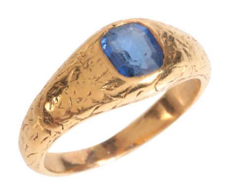 A SAPPHIRE RINGin high carat gold, set with a step cut sapphire of c.0.84 carats, held in a rubover setting to a band with en