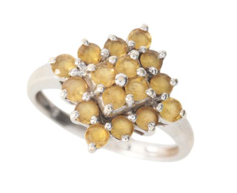 A CITRINE CLUSTER RINGin 9ct white gold, set with a cluster of round cut citrines, full British hallmarks, size K1/2 / 51, (c