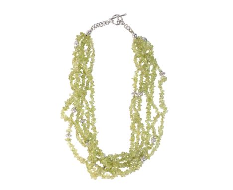 A PERIDOT BEAD NECKLACEcomprising five strands of tumbled peridot beads, accented by stylised 18ct white gold spacers, secure