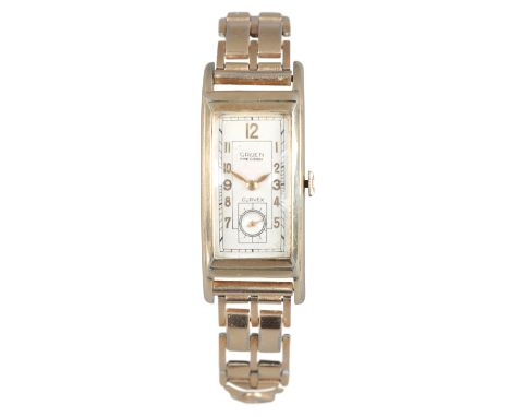 GRUEN CURVEX PRECISION: A GOLD-PLATED WRISTWATCHwith manual wind movement, the rectangular silver dial with gold Arabic numer