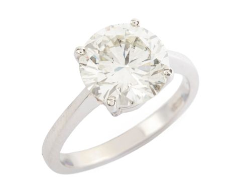 A 3.97 CARAT DIAMOND SOLITAIRE RING in platinum, set with a round brilliant cut diamond of c.3.97 carats, partial British hal