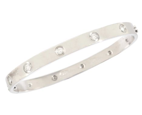 CARTIER: A DIAMOND LOVE BRACELET in 18ct white gold, set with ten round brilliant cut diamonds totalling c.1.00 carats, secur