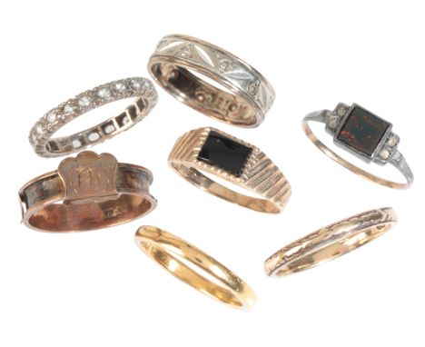 A COLLECTION OF RINGSof varying designs and sizes, including a 22ct gold wedding band; a bloodstone and paste ring in 9ct gol
