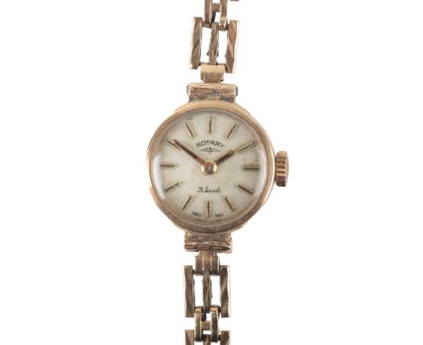 ROTARY: A 9CT GOLD BRACELET WATCHwith manual wind movement, the silver dial with gold baton hour markers and hands, circa 196