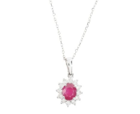A RUBY AND DIAMOND PENDANT NECKLACEin 18ct white gold, set with an oval cut ruby of c.0.85 carats, surrounded by a cluster of