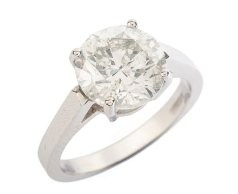 A 4.09 CARAT DIAMOND SOLITAIRE RING in platinum, set with a round brilliant cut diamond of c.4.09 carats, partial British hal