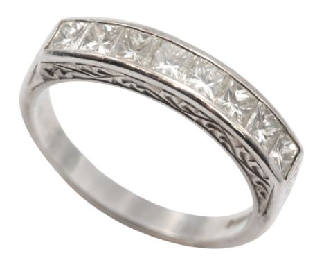A DIAMOND HALF ETERNITY RING&nbsp;in 18ct white gold, channel-set with princess cut diamonds totalling c.0.80 carats, over an