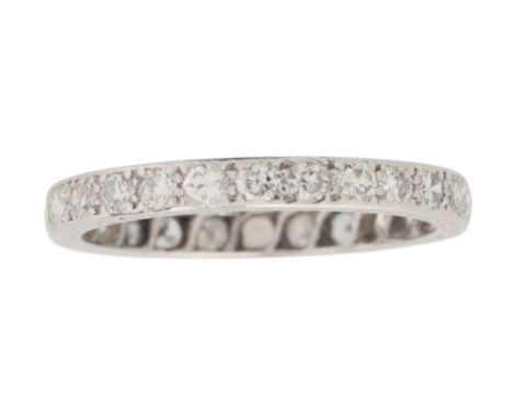 A DIAMOND ETERNITY RINGin platinum, set with old European cut diamonds, no assay marks, size L / 51, (c.2.2g)