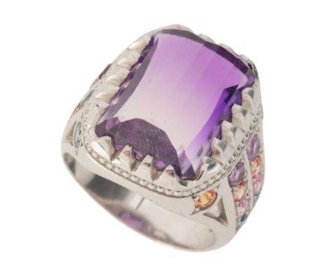 A GEM-SET RINGin sterling silver, set with a mixed cut amethyst, to coloured gem-set shoulders, stamped '925', size T1/2 / 62
