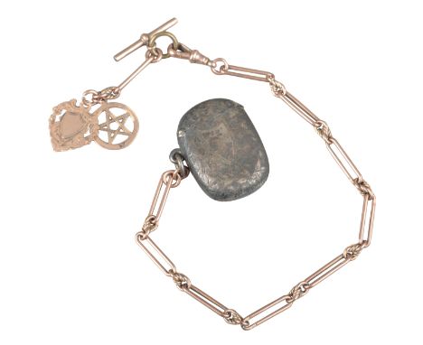 A 9CT GOLD POCKET WATCH CHAINwith elongated links, T bar, hung with two 9ct gold fobs and a silver vesta case, 17 grams