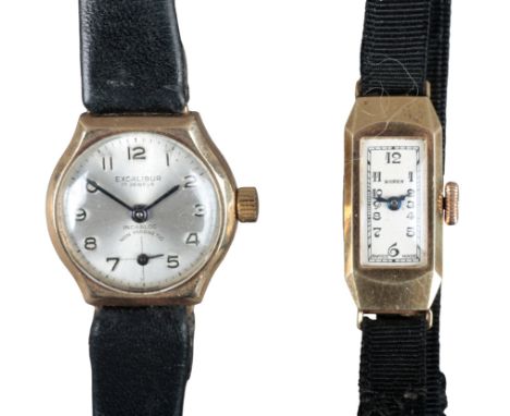 BUREN: A 9CT GOLD WRISTWATCHwith manual wind movement, the silver dial with black Arabic numerals and dark blue steel hands, 