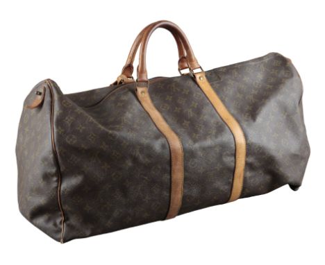 A LOUIS VUITTON KEEPALL BANDOULIÈRE 55 TRAVEL BAGmonogrammed coated canvas and vachetta leather, brass hardware and luggage t