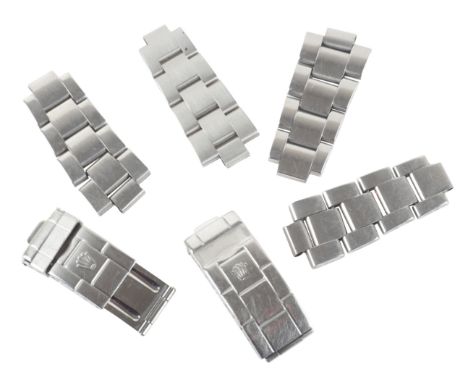 ROLEX: TWO STAINLESS STEEL WATCH BRACELET CLASPSand four various Rolex stainless steel bracelet parts (6)