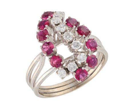 A RUBY AND DIAMOND COCKTAIL RINGin 14ct white gold, set with round cut rubies totalling 1.2-1.5 carats, and round brilliant c