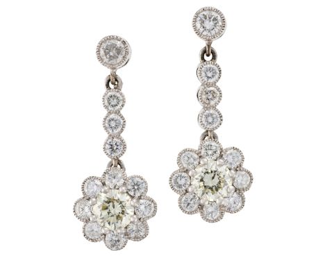A PAIR OF DIAMOND DROP EARRINGSin platinum, each comprising a diamond stud, articulated to a row of three round brilliant cut