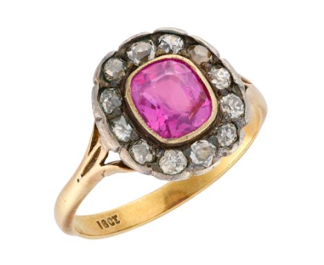 A GEORGIAN BURMA NO HEAT RUBY AND DIAMOND CLUSTER RING&nbsp;in silver on 18ct gold, set with a cushion cut ruby of c.1.60 car