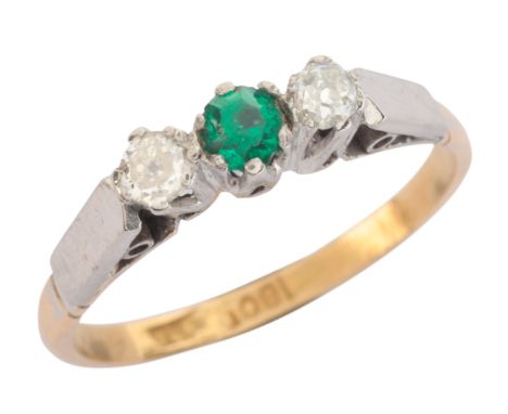 A GREEN PASTE AND DIAMOND THREE STONE RINGin 18ct gold and platinum, set with a round cut green paste stone, flanked by old c