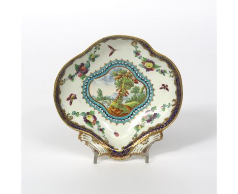 A Worcester shell-shaped dessert dish, c.1780, decorated in a pattern similar to the Earl of Dalhousie, with a shaped landsca