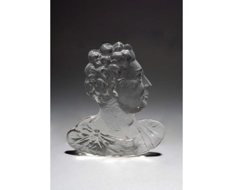A glass portrait plaque, 19th century, after Bernard Perrot, moulded as the head and shoulders of a Roman gentleman in profil
