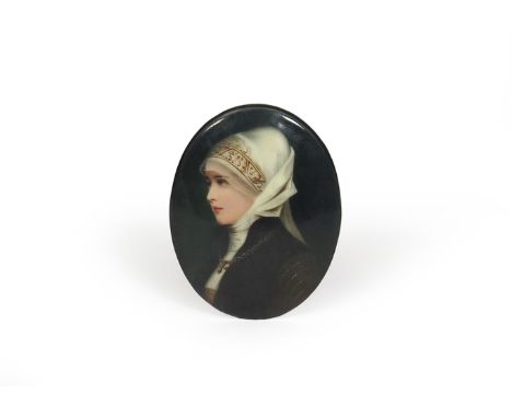 A KPM porcelain oval portrait plaque, 19th century, painted with a lady wearing a head scarf of medieval type, a cross around