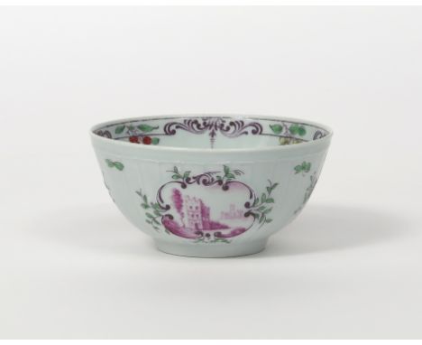 A rare Worcester small bowl, c.1756-58, finely moulded with small rococo panels on a strap-fluted body, the panels painted in