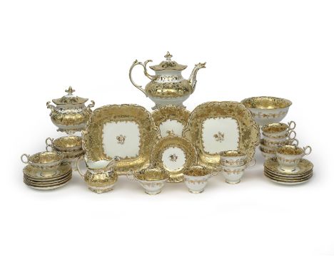 A Coalport tea service, c.1830, decorated in pattern 4/808 within continuous gilded grapevine bands on a buff ground, the tea