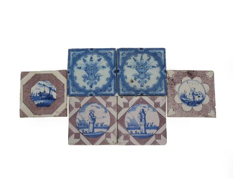 A pair of Bristol delftware tiles, c.1740-60, painted in blue with baskets of flowers in a lobed panel between angel head cor