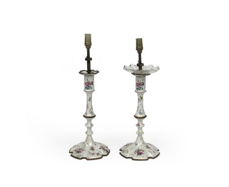A pair of South Staffordshire enamel candlesticks, c.1770, finely painted with flower sprays and single scattered sprigs in p