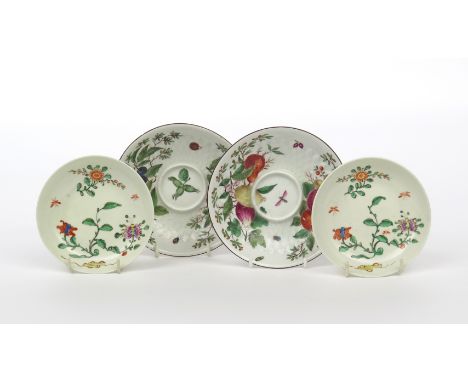 Two Chelsea trembleuse saucers, c.1758-60, moulded with radiating sepals and painted with fruit and berry sprays amid scatter