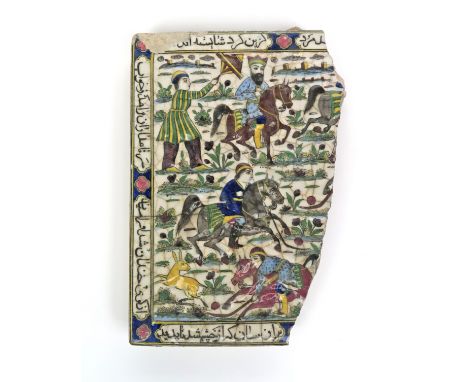 A Qajar tile fragment, 19th century, moulded and enamelled with a scene of figures on horseback and one flying a kite, the ed