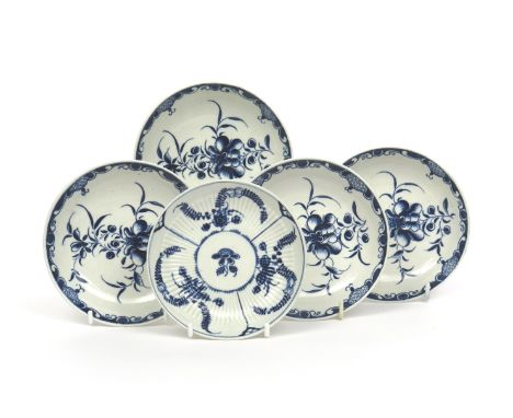 Four Lowestoft blue and white saucers, c.1770, painted in the Mansfield pattern, open crescent marks, and a Worcester saucer 